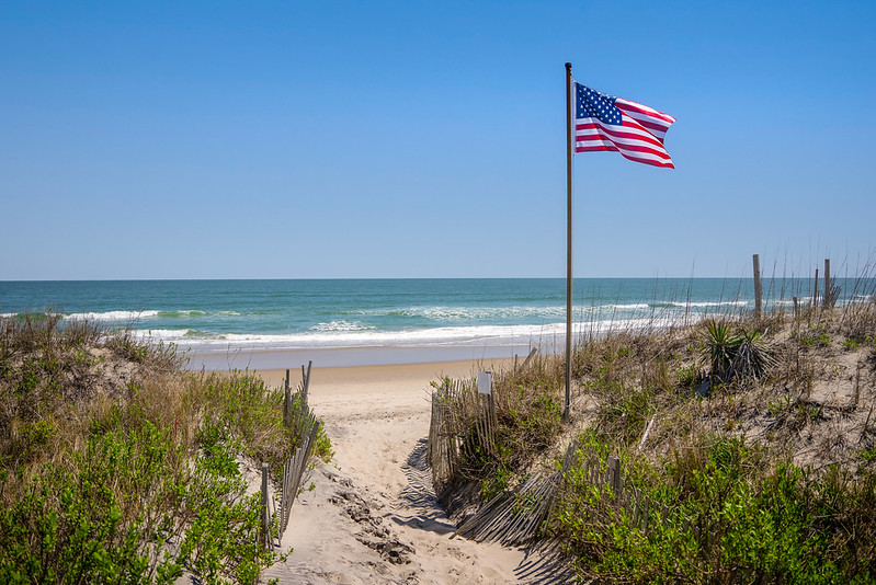 American flag on dune