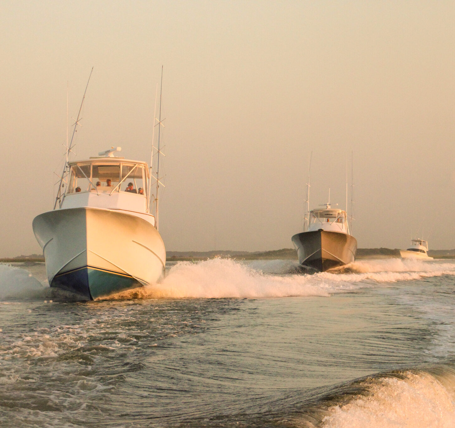 Charter boats headed out at sunrise for an exciting day of fishing off the coast of the Outer Banks.